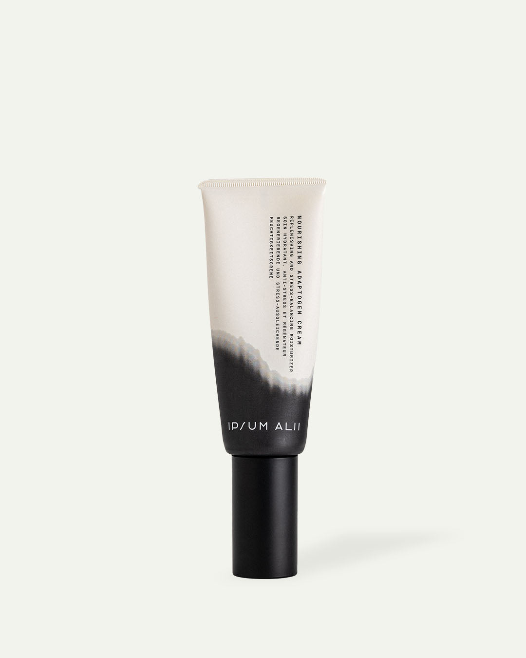 Skincare cream tube with black cap and gradient design on a light background.