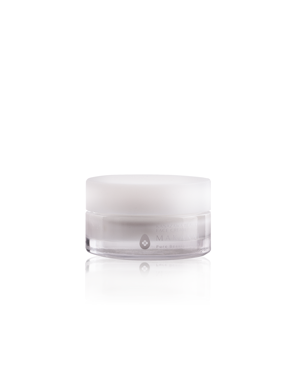 A clear jar of Makanai Kanazawa Beauty Face Cream with a white lid, shown against a transparent background. The jar features minimal white text and a small droplet logo on the front.