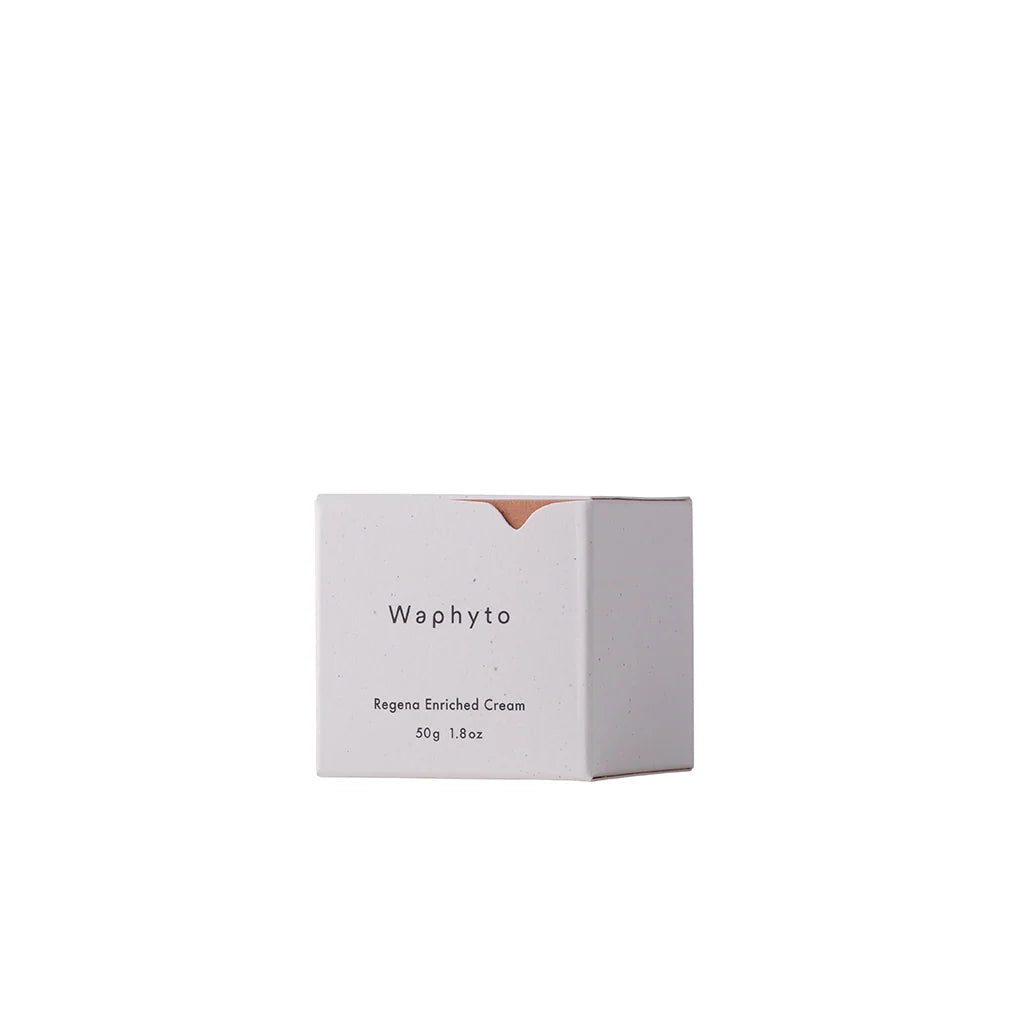 A small rectangular Waphyto box stands against a white background. The minimalist packaging reads “Regena Enriched Cream,” reflecting a clean and refined design.