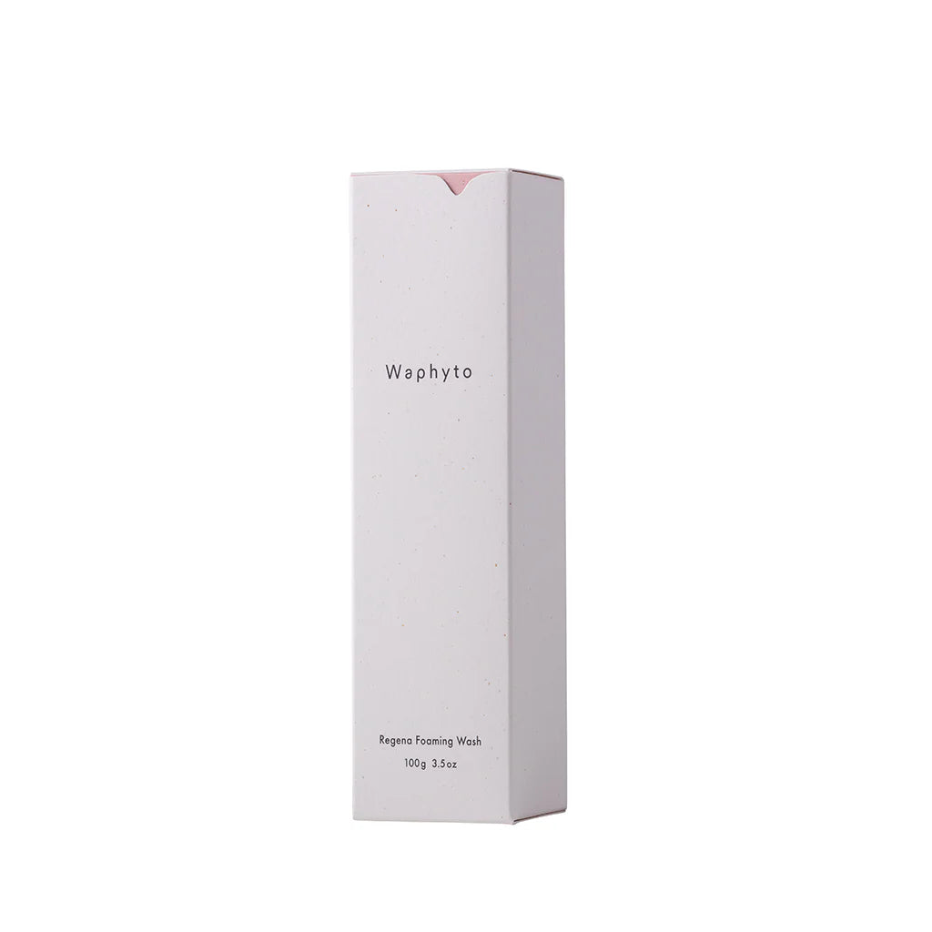 A rectangular Waphyto box stands upright against a white background. The simple packaging design reads “Regena Foaming Wash” and reflects a clean, minimalist aesthetic.